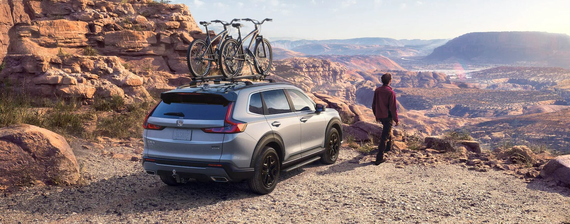 Screenshot%202025-03-18%20203819.png A 2025 Honda CR-V Hybrid sitting on top of a desert cliff.