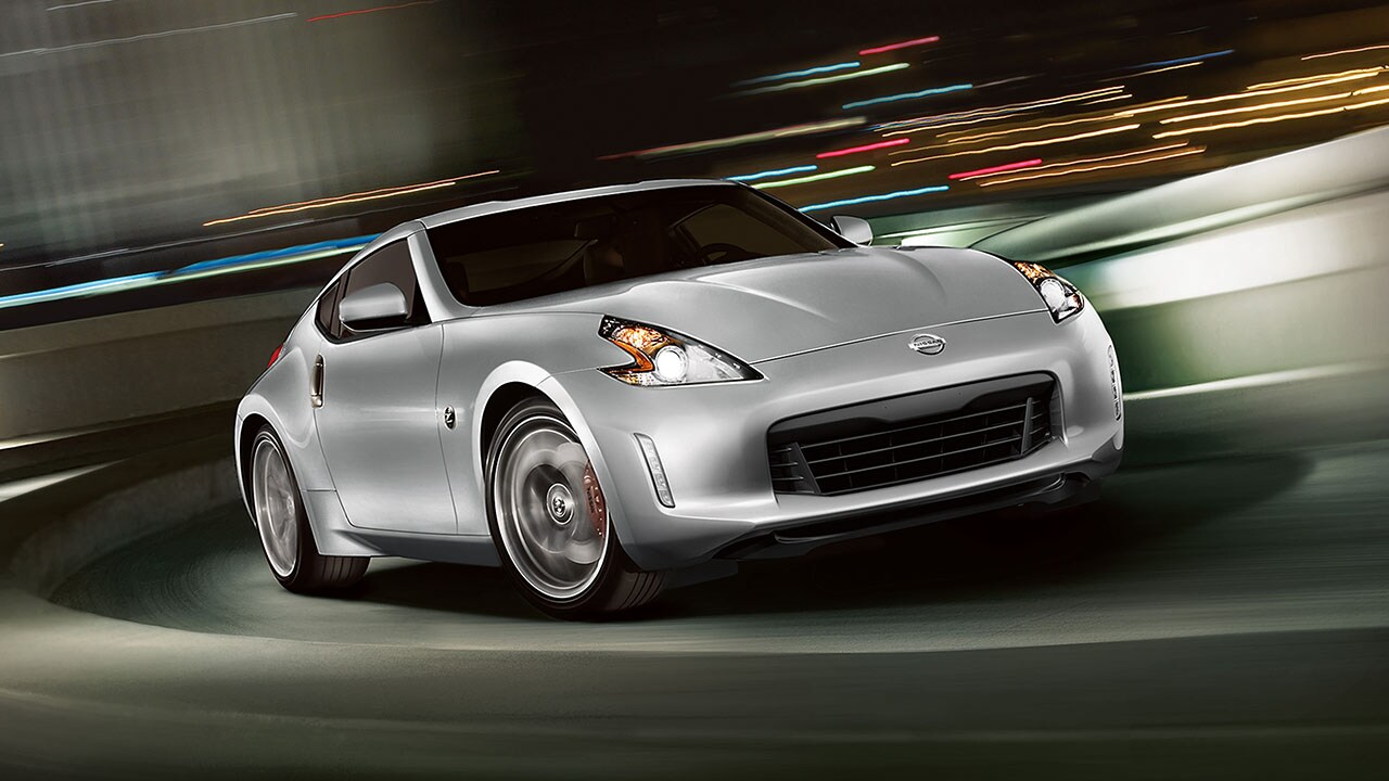 2016-nissan-370Z-coupe-sport-brilliant-silver-highway-night-driving.jpg