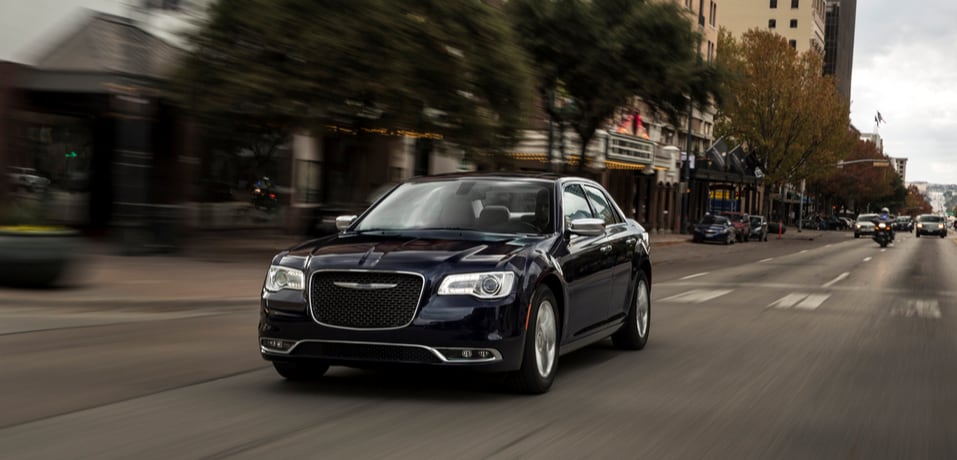 2016 Chrysler 300 black driving down street