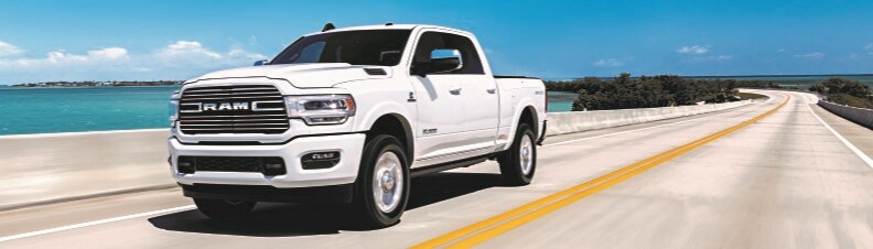 White RAM 2500 front driver side view