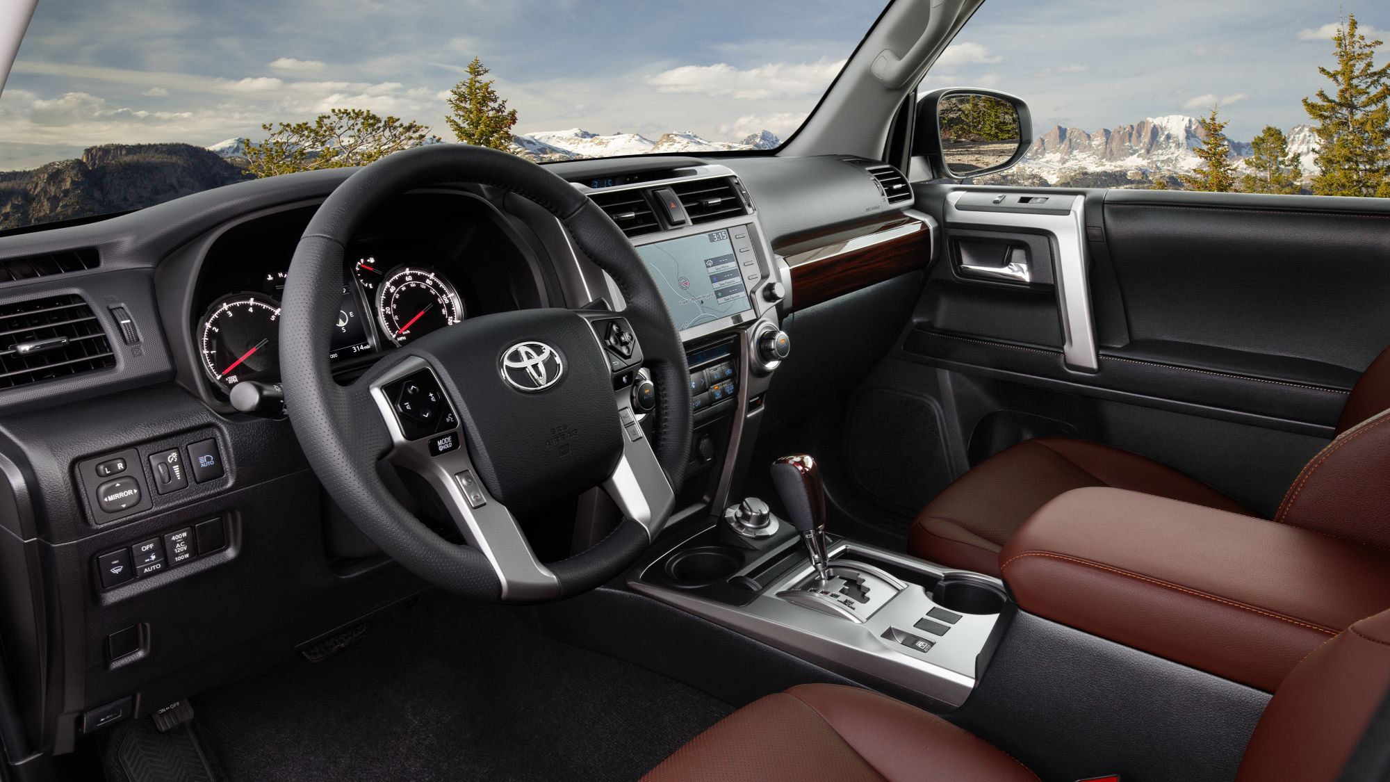FRN_MY23_0022_V001_eAGr1rIcmJkb0OD0HsGPKiNY.jfif The interior of a Toyota 4Runner with snow covered mountains seen through the windshield.