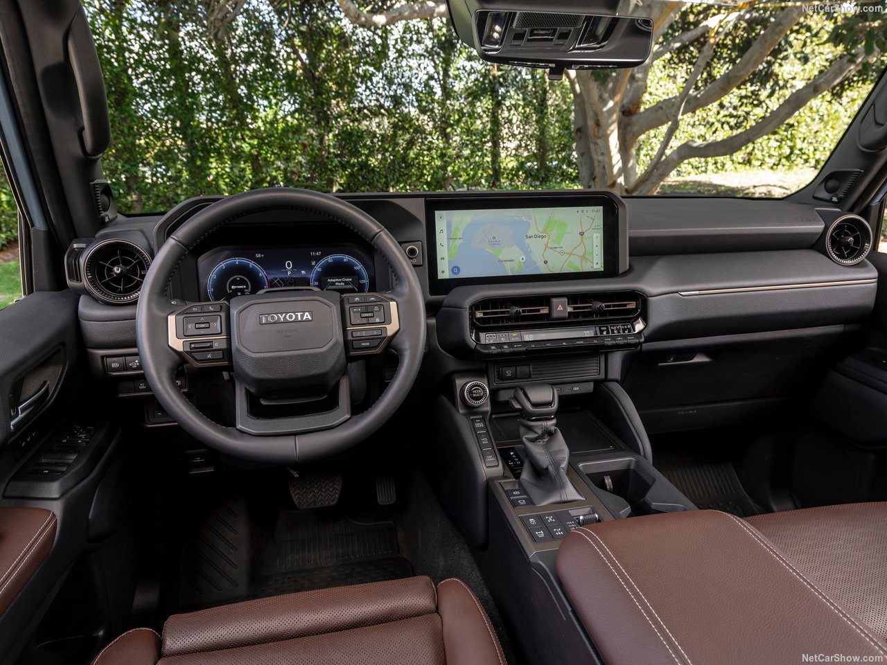 Modern, rugged interior of the 2026 Toyota Land Cruiser with large touchscreen