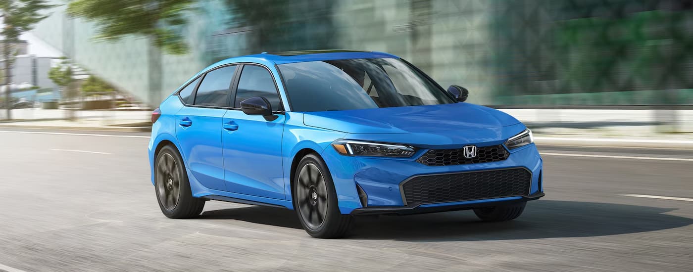 Honda%20Civic%20For%20Sale%20Near%20Dearborn%20-%202025%20Honda%20Civic%20Hatchback%20-%20Blue%20copy.jpg Blue 2025 Honda Civic Hatchback for sale near Dearborn driving down a road.