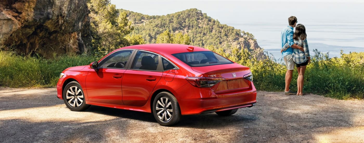 2026 Honda Civic LX Red (1).jpg Red 2026 Honda Civic LX parked overlooking a mountain view