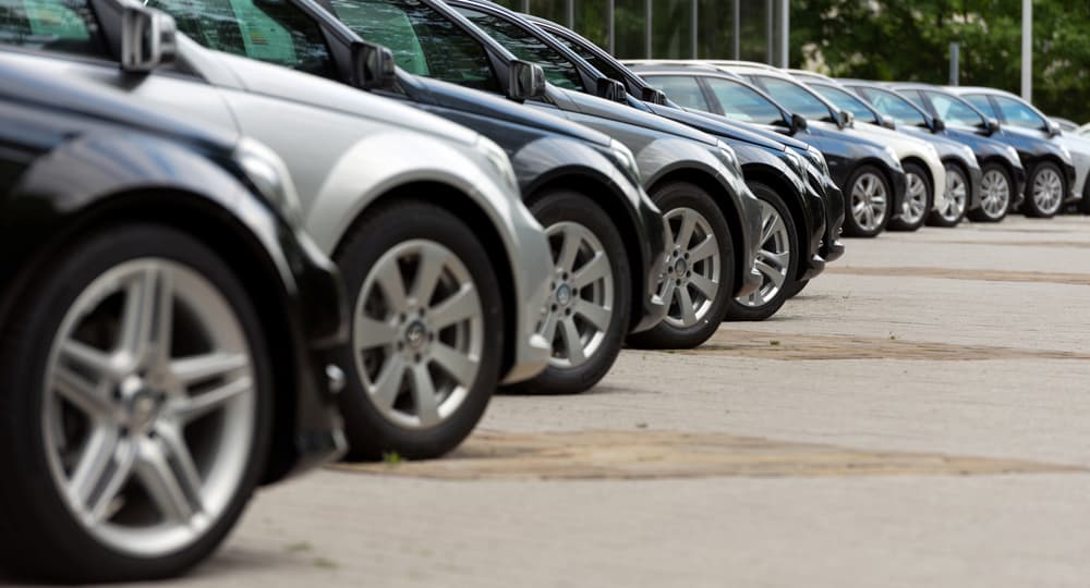Photo of vehicles lined up at a dealership.jpg