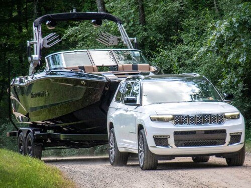 2025 Jeep Grand Cherokee towing a boat