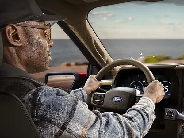man driving a 2025 Ford F-150