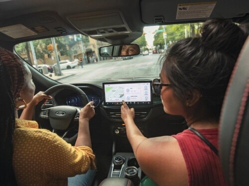 View of two women in front seat of 2026 Ford Escape using navigation