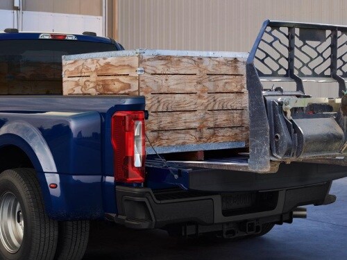 Wood pallets being loaded into back of 2026 Ford F-250
