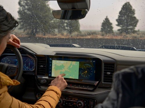 View of man using the navigation on the touchscreen of a 2025 Chevrolet
Silverado 1500