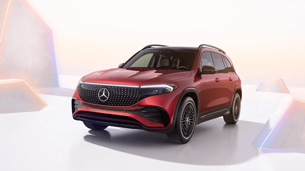 Learn about the specs & features of the 2025 Mercedes-Benz EQB SUV Rendered image of a Mercedes-Benz EQB SUV surrounded by geometric shapes