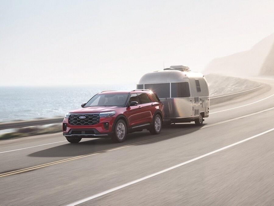 Ford Explorer towing a trailer on the highway