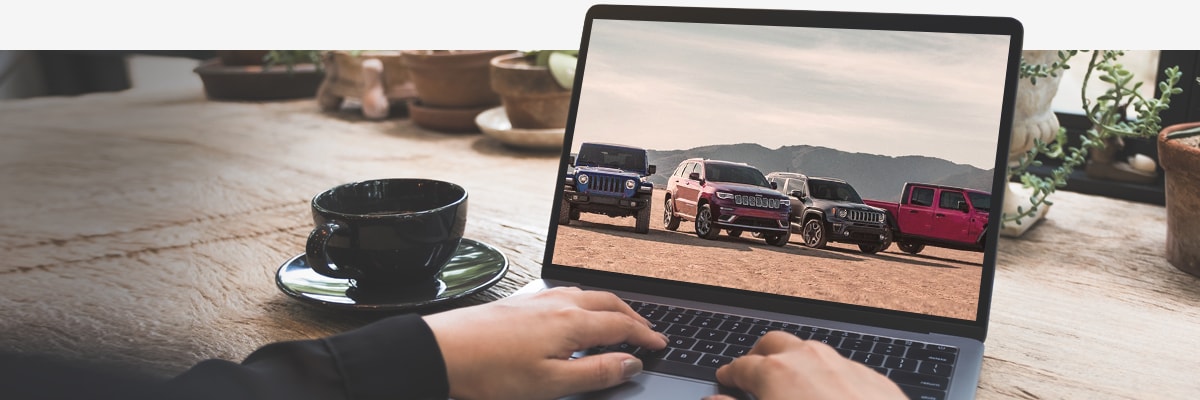 NY Jeep Dealer Shop at Home Program Shopping on computer