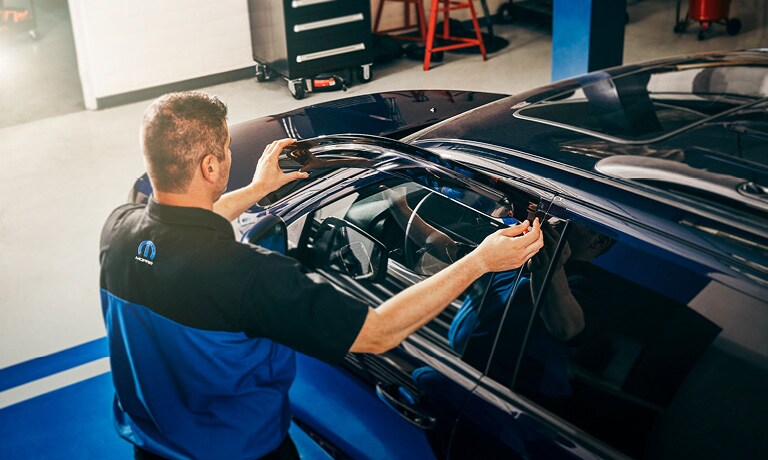 Technician replacing car door