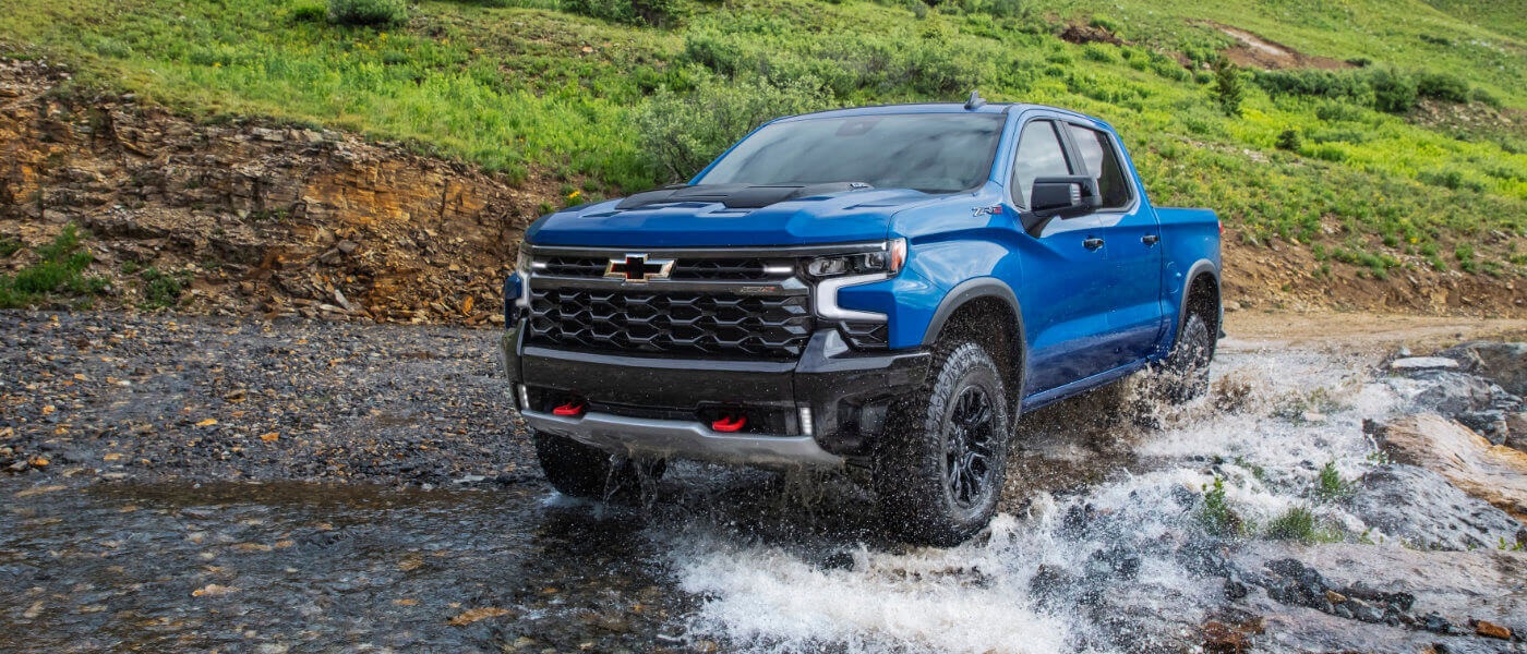 2025 Chevy Silverado 1500 offroading in a stream