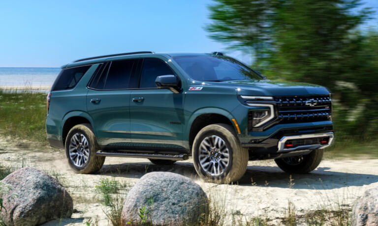 2025 Chevy Tahoe offroading by a lake