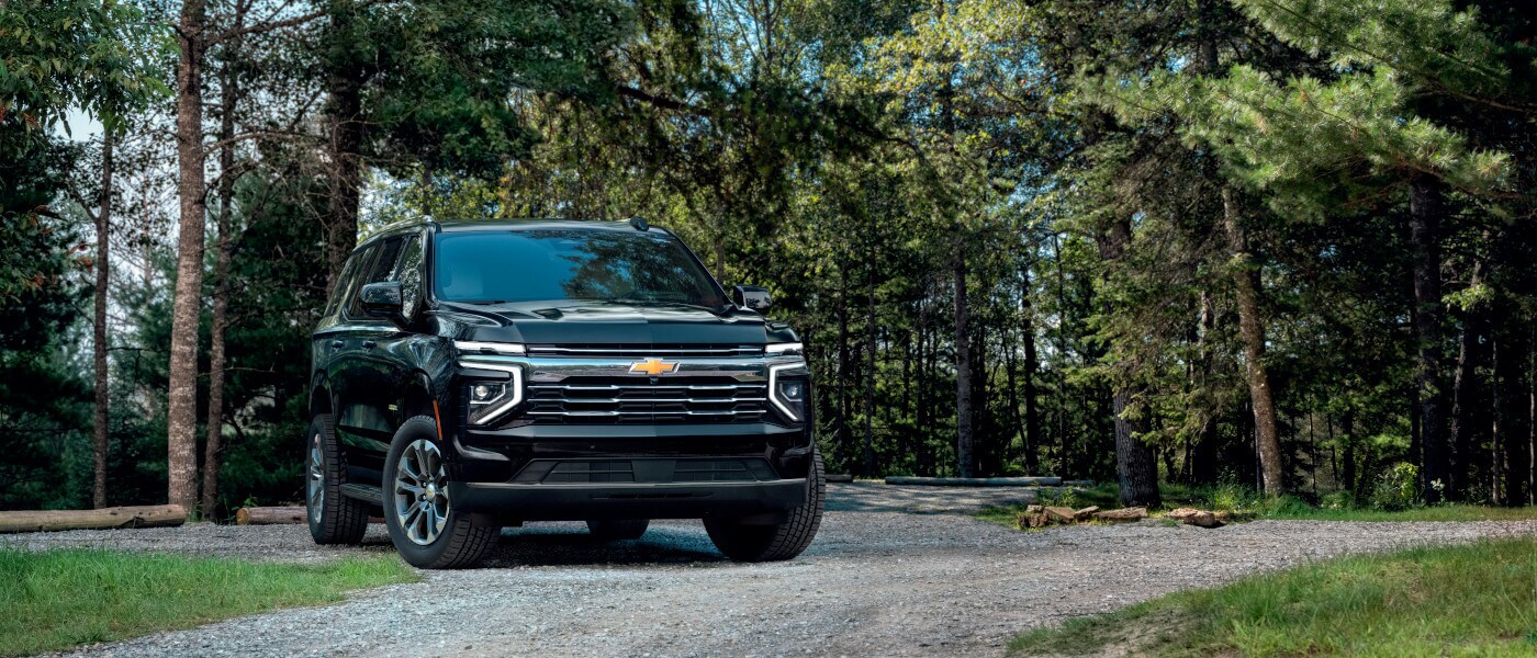 2025 Chevy Tahoe parked in a forest