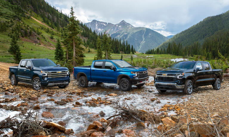 2026 Chevy Silverado 1500 lineup parked in mountains