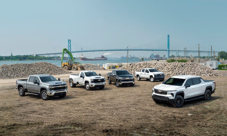 2025 Chevy Silverado 3500 HD lineup at a construction site