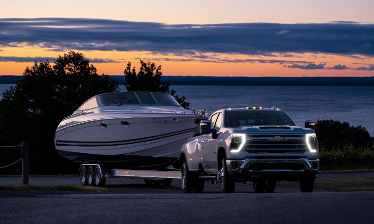 2025 Chevy Silverado 3500 HD towing a boat