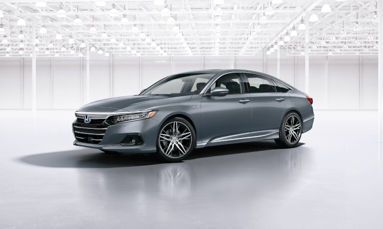 2022 Honda Accord hybrid parked in a white room