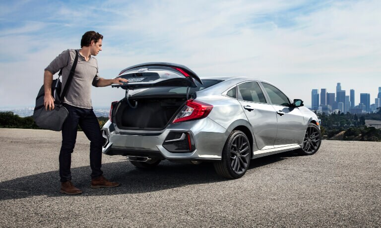 2021 Honda Civic with man loading trunk