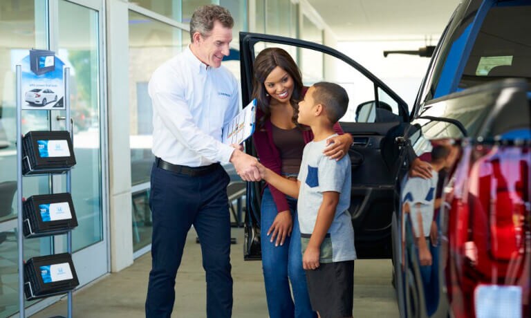 Mother and son making deal on car