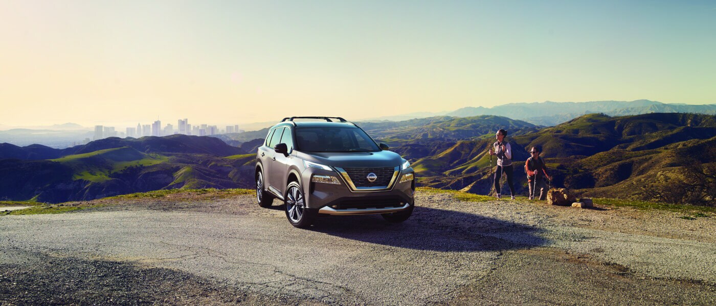 2023 Nissan Rogue in mountains with hikers