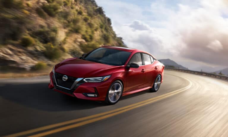 2021 Nissan Sentra taking a curve on a highway