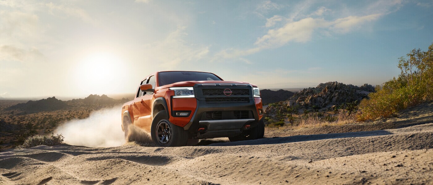 2025 Nissan Frontier driving in sand