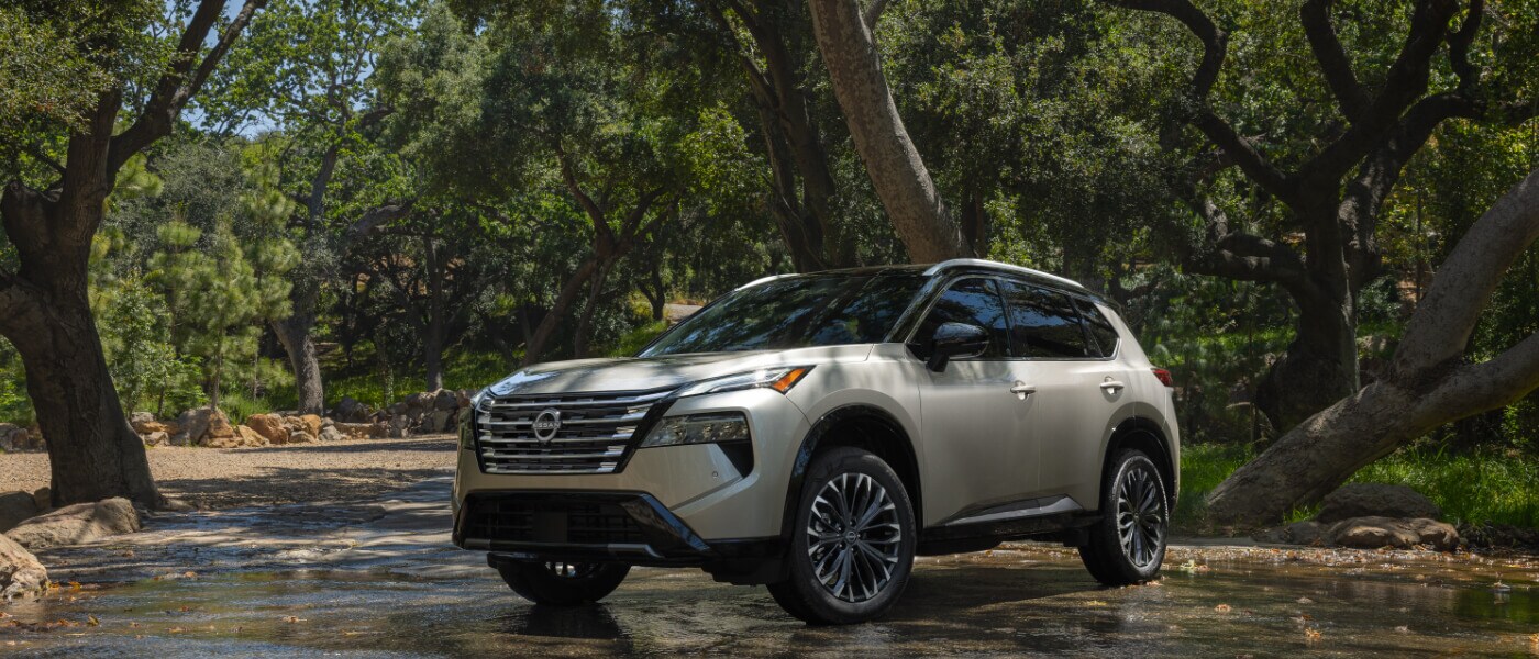 2026 Nissan Rogue parked in a forest