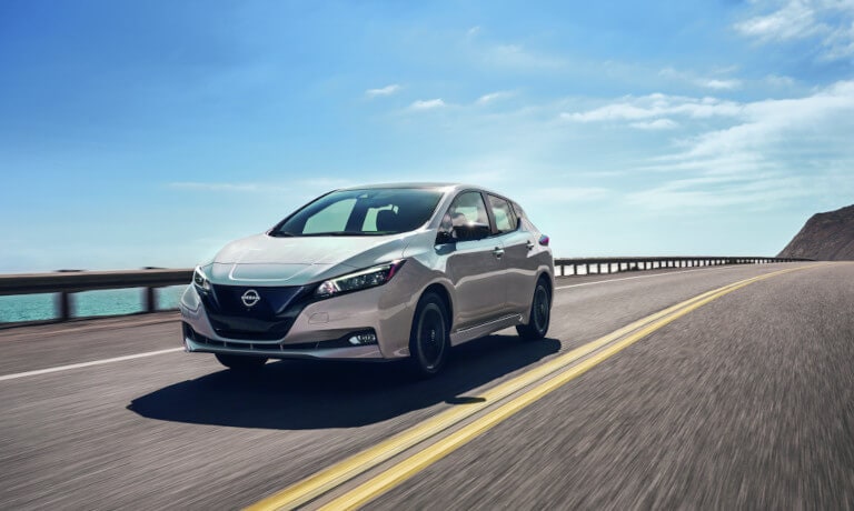 2024 Nissan LEAF driving seaside