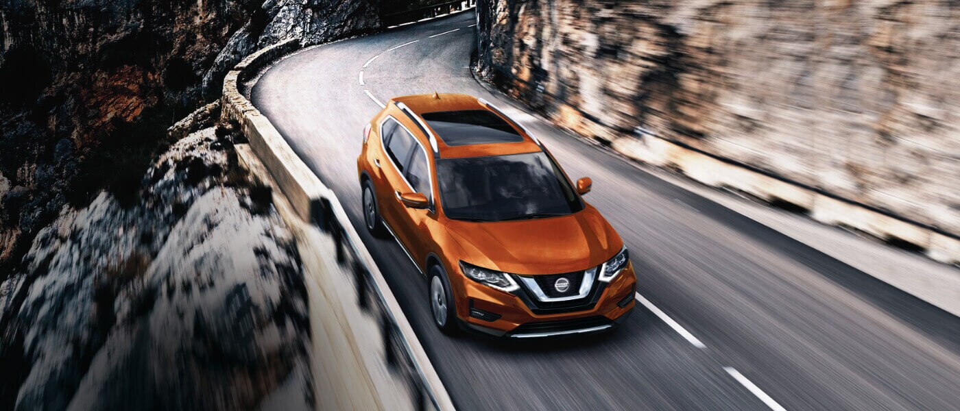 2020 Nissan Rogue driving on a mountainside road