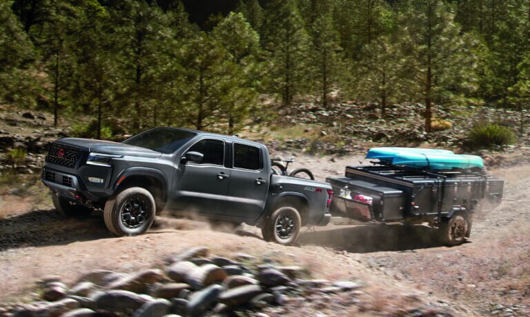 2022 Nissan Frontier towing a small trailer with kayaks