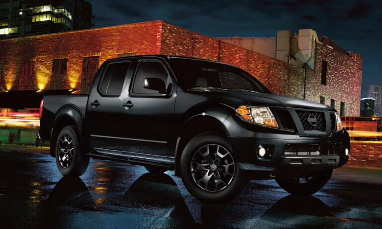 2021 Nissan Frontier parked on city street at night
