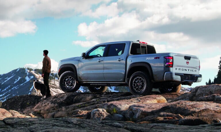 2023 Nissan Frontier in the mountains with a dog