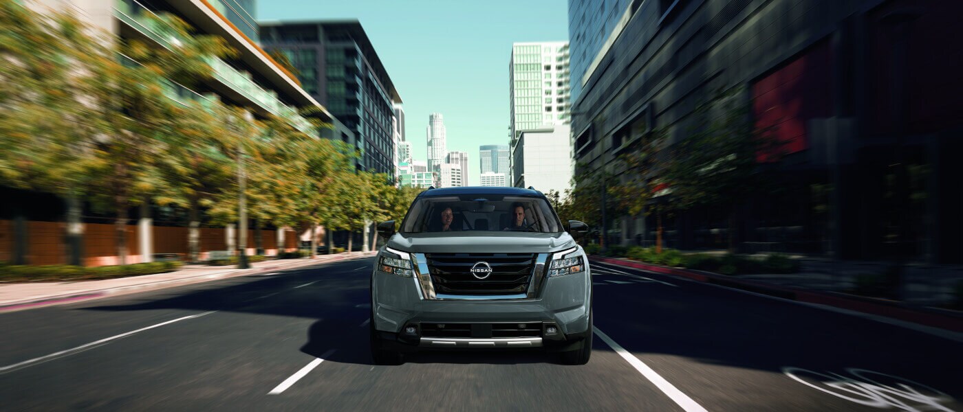 2025 Nissan Pathfinder driving head on in city