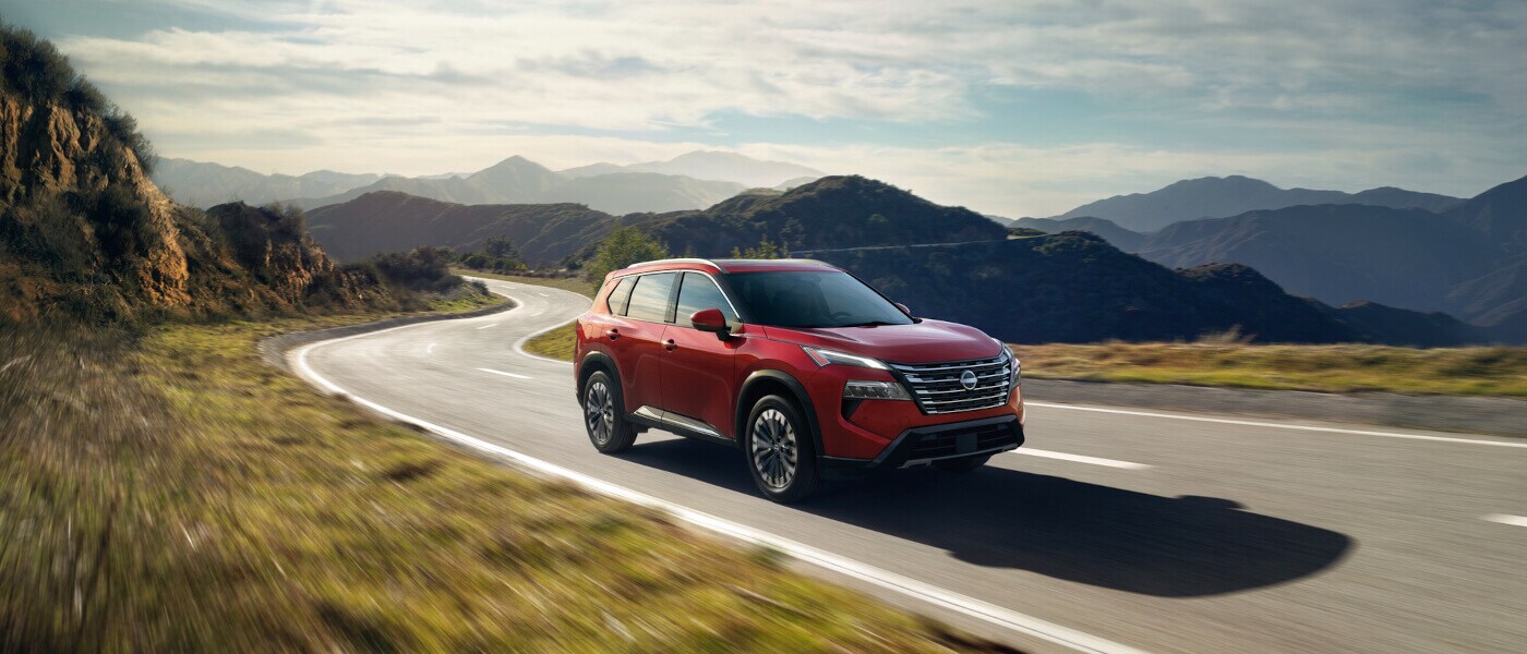 2025 Nissan Rogue driving in the hills