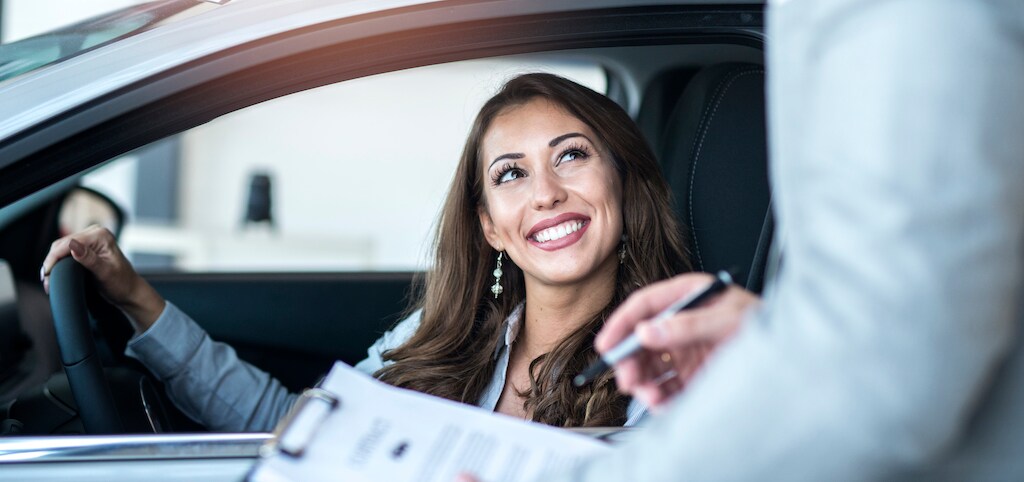 happy-customer-buying-brand-new-car-local-car-dealership.jpg