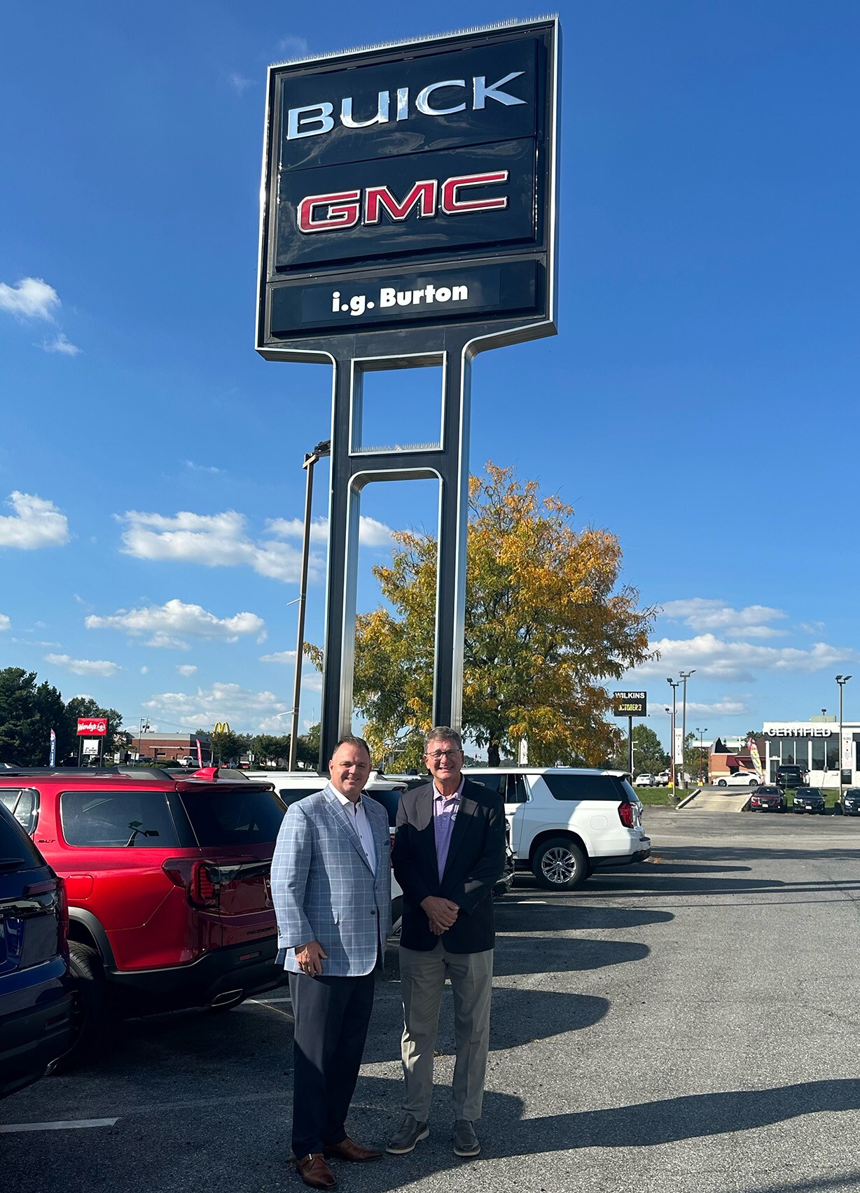 MJ Lofland and Charlie Burton in front of i.g. Burton Buick GMC of Glen Burnie.jpg