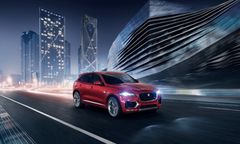 2020 Jaguar F-PACE driving through the city