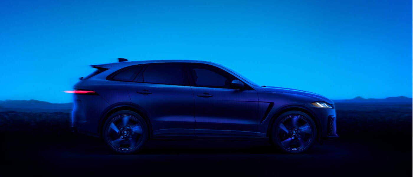2026 Jaguar F-PACE side view in a blue field