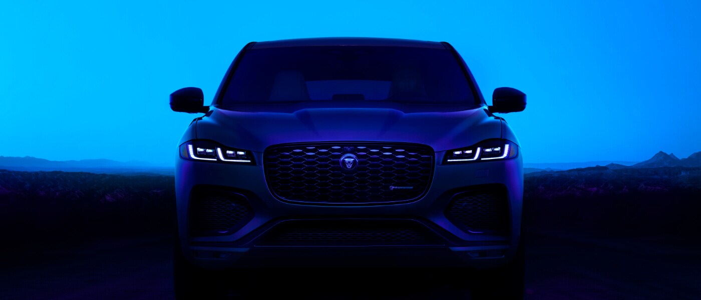 2025 Jaguar F-PACE head on in desert at night