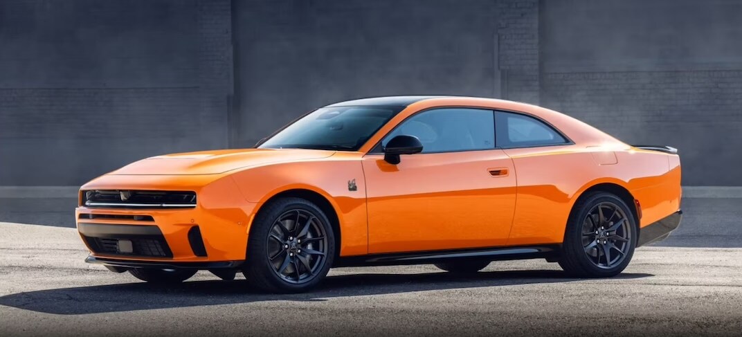 Orange Dodge Charger shown from the front and driver's side