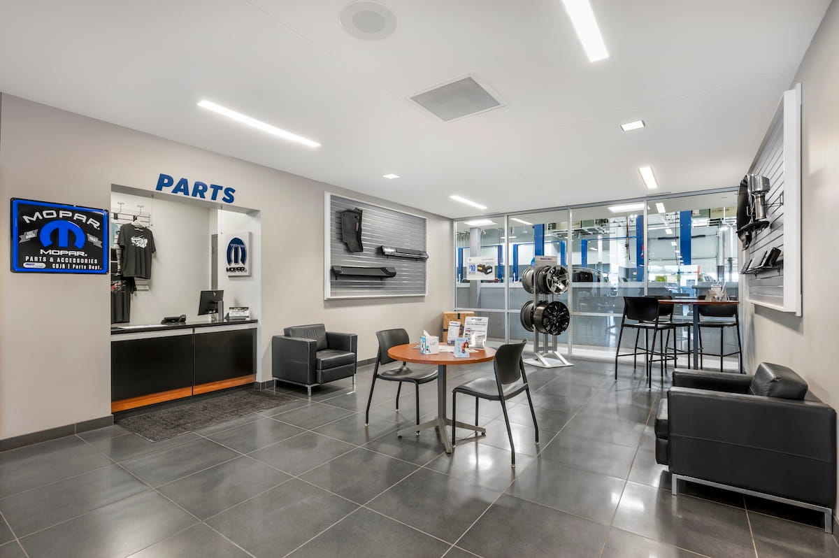 Customer waiting area and Mopar parts counter inside Indy CDJR in Brownsburg, Indiana