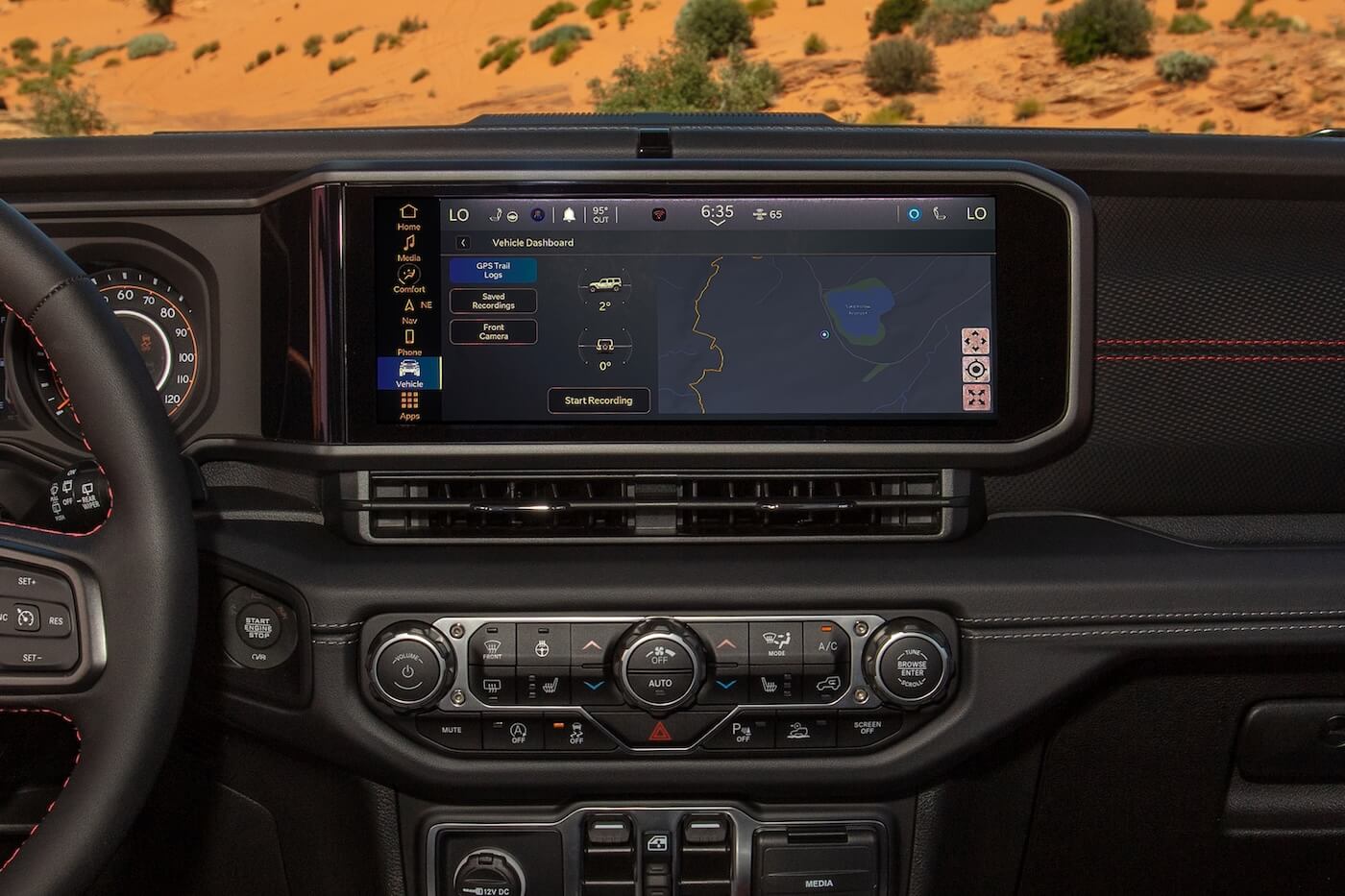 Jeep Gladiator dashboard displaying the Off-Road Pages app on the Uconnect touchscreen
