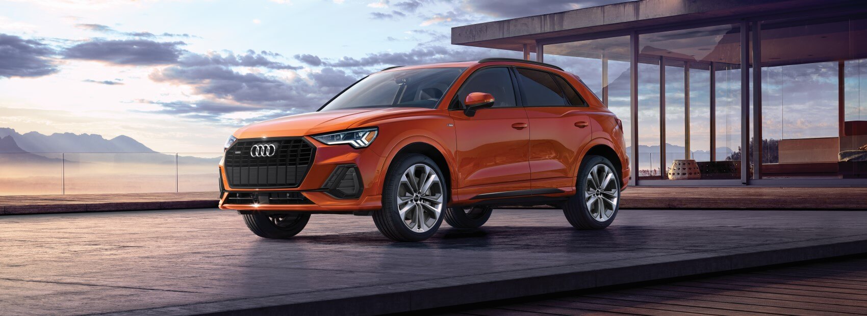 Audi Q3 parked in front of home.