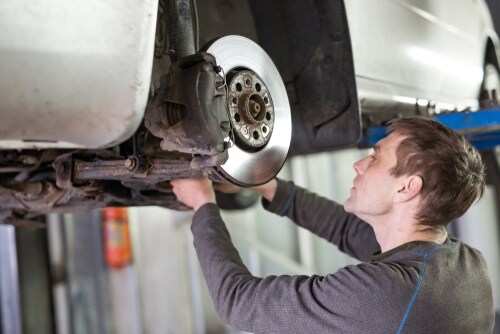 mechanic looking at disc
