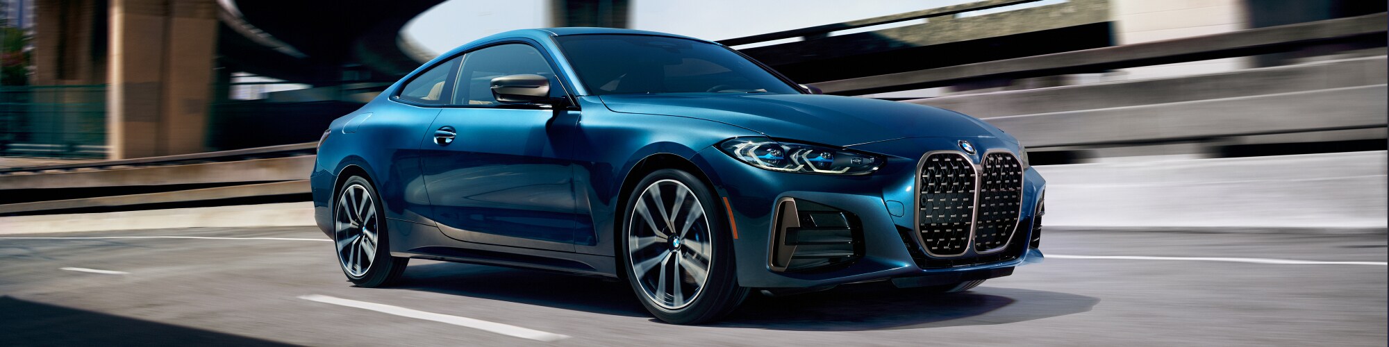 2021-BMW-4Series-430i-MSport-Coupe-L01 (2).jpg New BMW 4 Series Coupe driving on the highway