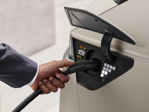 2025 Hyundai IONIQ 5 close up view of man charging vehicle